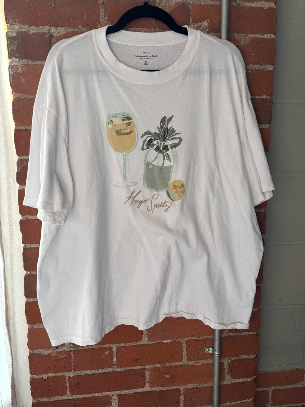 Abercrombie & Fitch White Tee with Pastel Beverage and Plant Graphic